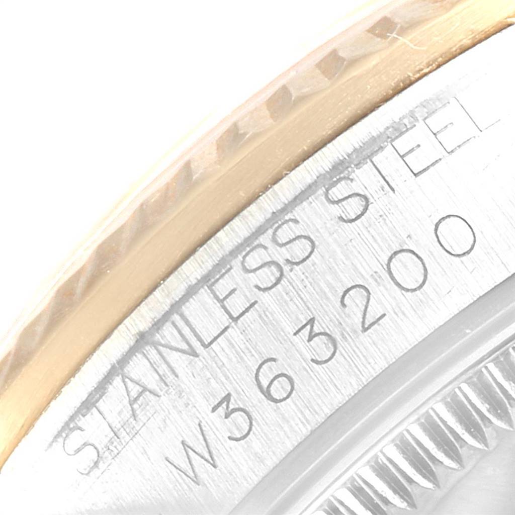 This close-up image of the Rolex Mid-Size 68273 Women's Steel and Gold (two tone) Blue Dial 68273 Women's Steel and Gold (two tone) Blue Dial model shows a portion of the watch’s bezel and engraved stainless steel case.