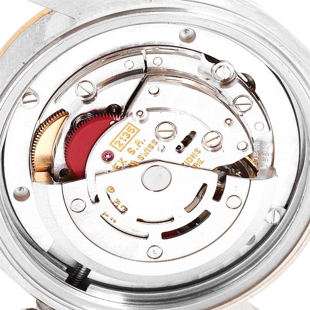 This image shows the internal movement and mechanism of a mid-size Rolex watch, viewed from the back.