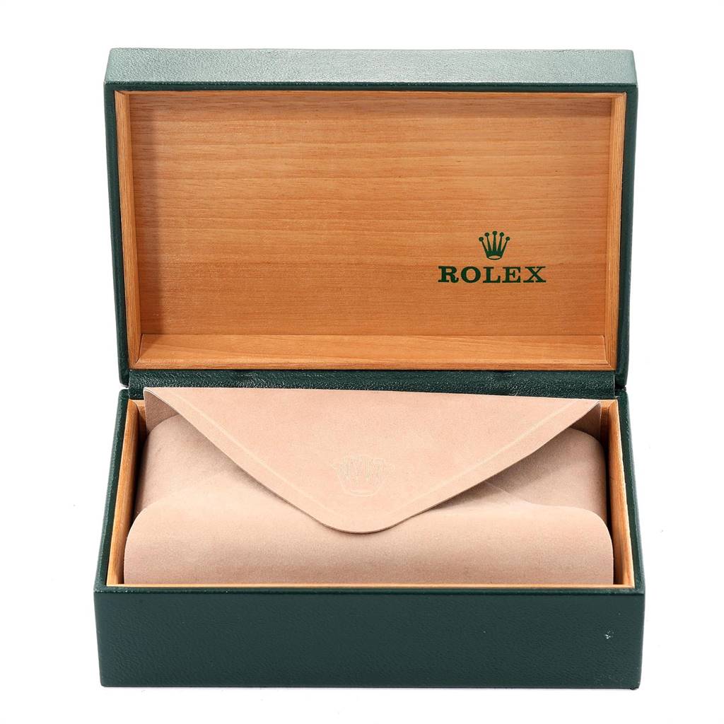 The image shows an opened Rolex watch box containing a beige pouch, typically used for a mid-size watch model.