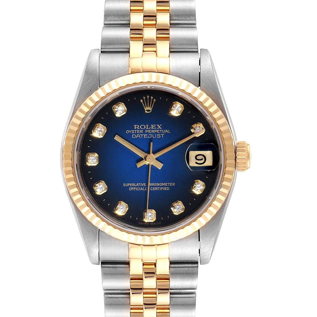 This image shows a frontal view of a Rolex Oyster Perpetual Datejust Mid-Size watch, featuring a two-tone band and a blue dial with diamond markers.