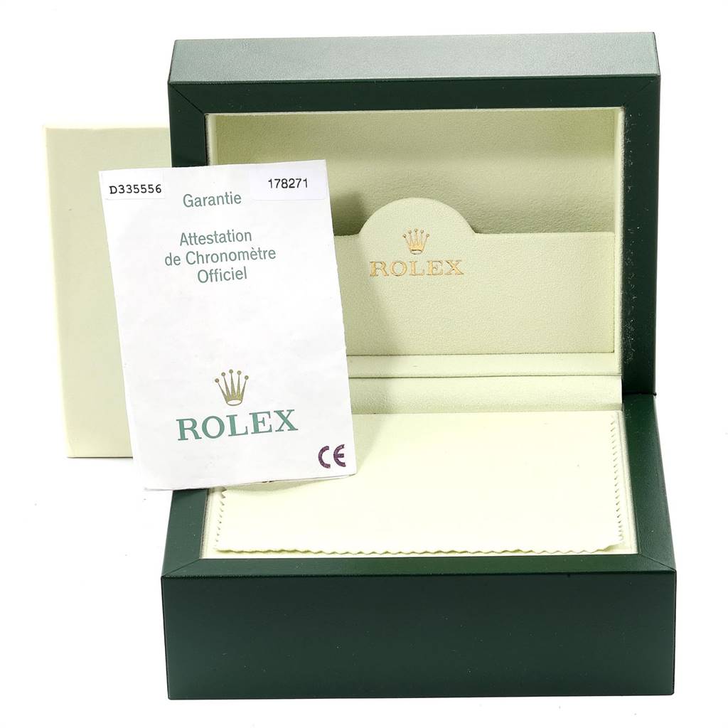 The image shows a Rolex Mid-Size 178271 Women's Steel and Gold (two tone) Black Dial 178271 Women's Steel and Gold (two tone) Black Dial watch box with a certificate of authenticity placed inside.