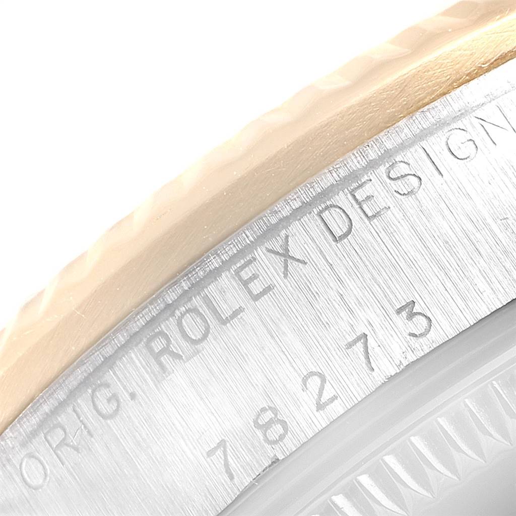 This image shows a close-up angle of the bezel and engraved design number on a Rolex Mid-Size 78273 Women's Steel and Gold (two tone) Blue Dial 78273 Women's Steel and Gold (two tone) Blue Dial watch.