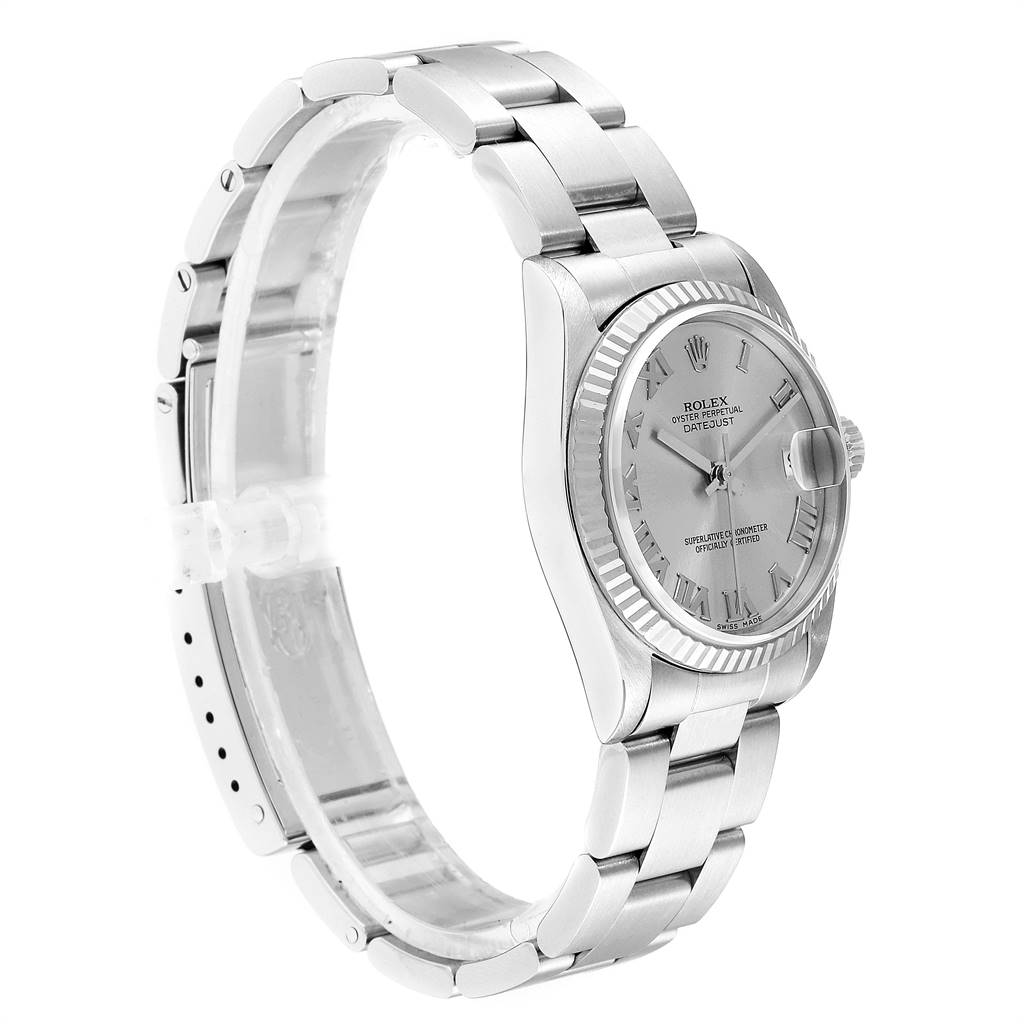 This image shows a side angle of a Rolex Mid-Size 68274 Women's Stainless Steel Silver Dial 68274 Women's Stainless Steel Silver Dial model, highlighting the bracelet, case, and face.