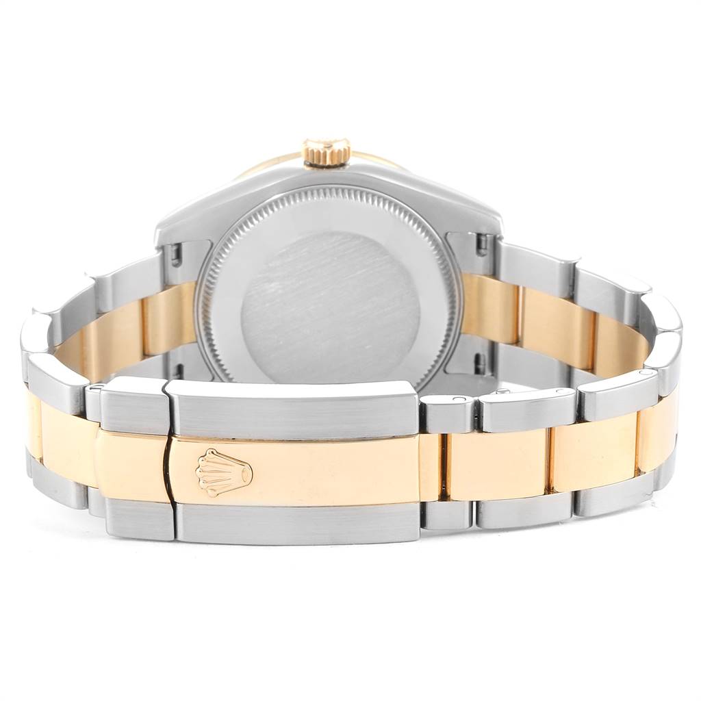 The image shows the back and bracelet of a Mid-Size Rolex watch, highlighting the two-tone design and clasp with the Rolex logo.