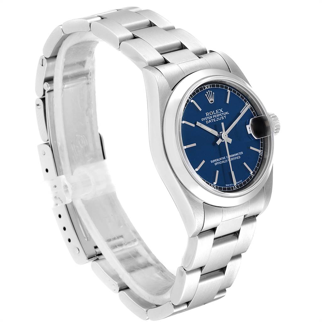 The image shows a side angle of a Rolex Mid-Size 78240 Women's Stainless Steel Blue Dial 78240 Women's Stainless Steel Blue Dial model watch, highlighting its blue dial, bezel, crown, and metal bracelet.