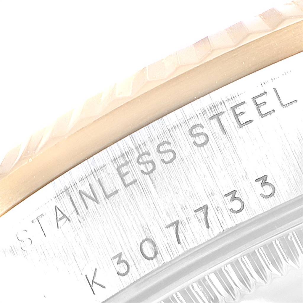 The image shows a close-up of the stainless steel casing and engraved serial number of a Rolex Mid-Size 178273 Women's Steel and Gold (two tone) Silver Dial 178273 Women's Steel and Gold (two tone) Silver Dial model.