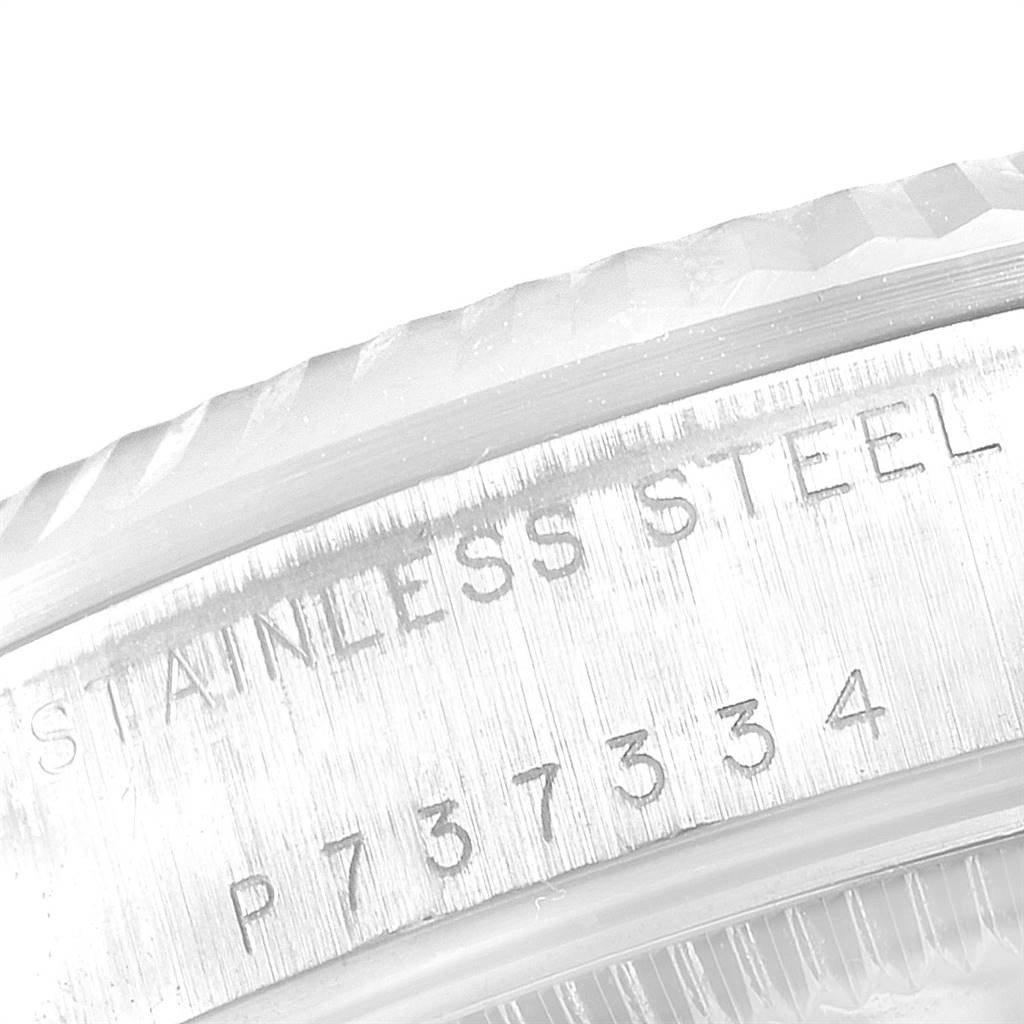 The image shows a close-up of the stainless steel case with engraved numbering on a Mid-Size Rolex watch.