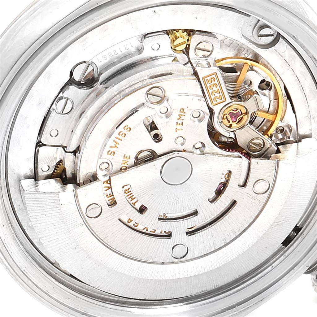 This image shows a close-up of the internal mechanism of a mid-size Rolex watch, highlighting its intricate movement parts.