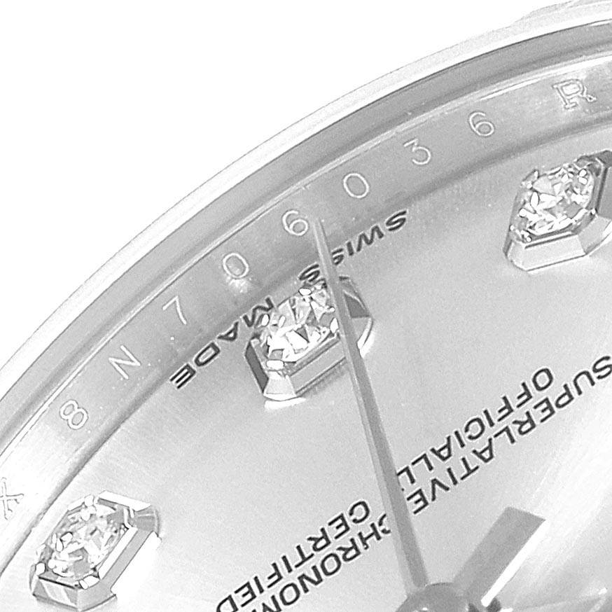 This close-up angle showcases the dial, diamond markers, and hands of a Mid-Size Rolex watch.