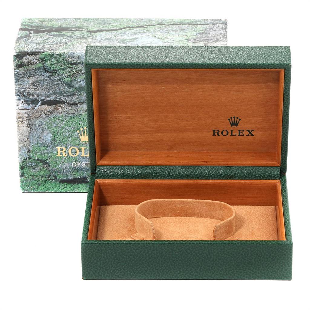 The image shows an open green Rolex box with a wooden interior for a mid-size Rolex model watch.