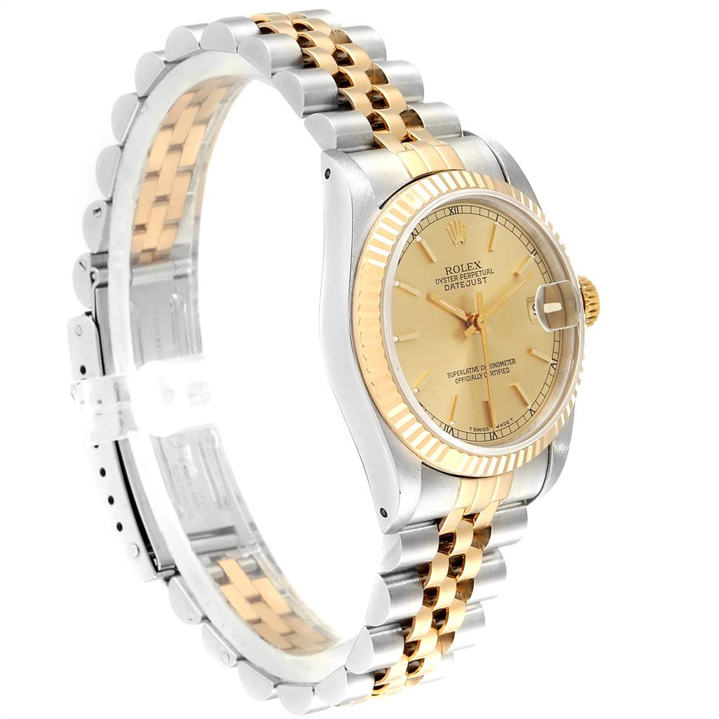 The image shows a side angle of a Rolex Mid-Size 68273 Women's Steel and Gold (two tone) Champagne Dial 68273 Women's Steel and Gold (two tone) Champagne Dial Datejust watch, highlighting the gold and silver two-tone bracelet, bezel, and dial.