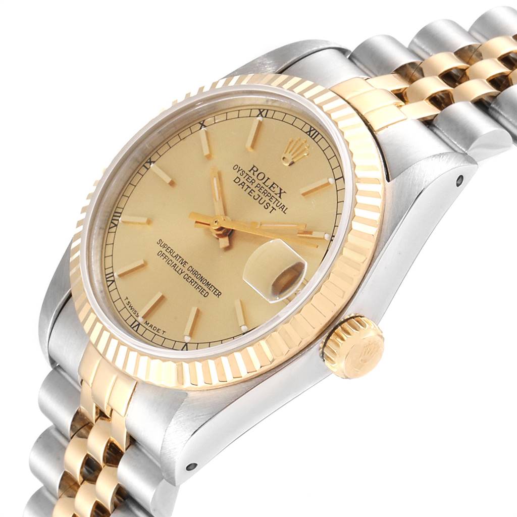 The image shows a Rolex Mid-Size 68273 Women's Steel and Gold (two tone) Champagne Dial 68273 Women's Steel and Gold (two tone) Champagne Dial Datejust watch angled to display the face, fluted bezel, crown, and part of the metal bracelet.