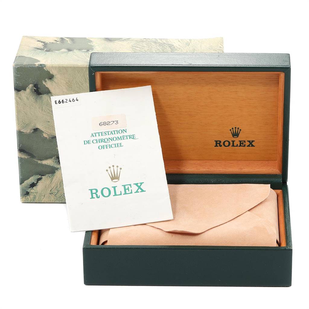 This image shows a Rolex Mid-Size 68273 Women's Steel and Gold (two tone) White Dial 68273 Women's Steel and Gold (two tone) White Dial watch box, with paperwork and packaging material inside.