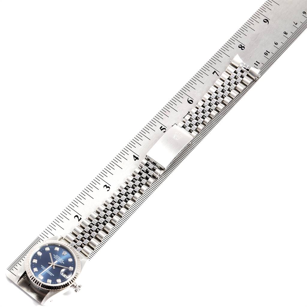 The Rolex Mid-Size 68274 Women's Stainless Steel Blue Dial 68274 Women's Stainless Steel Blue Dial watch is shown laid flat with the ruler measuring the band and blue dial face visible.
