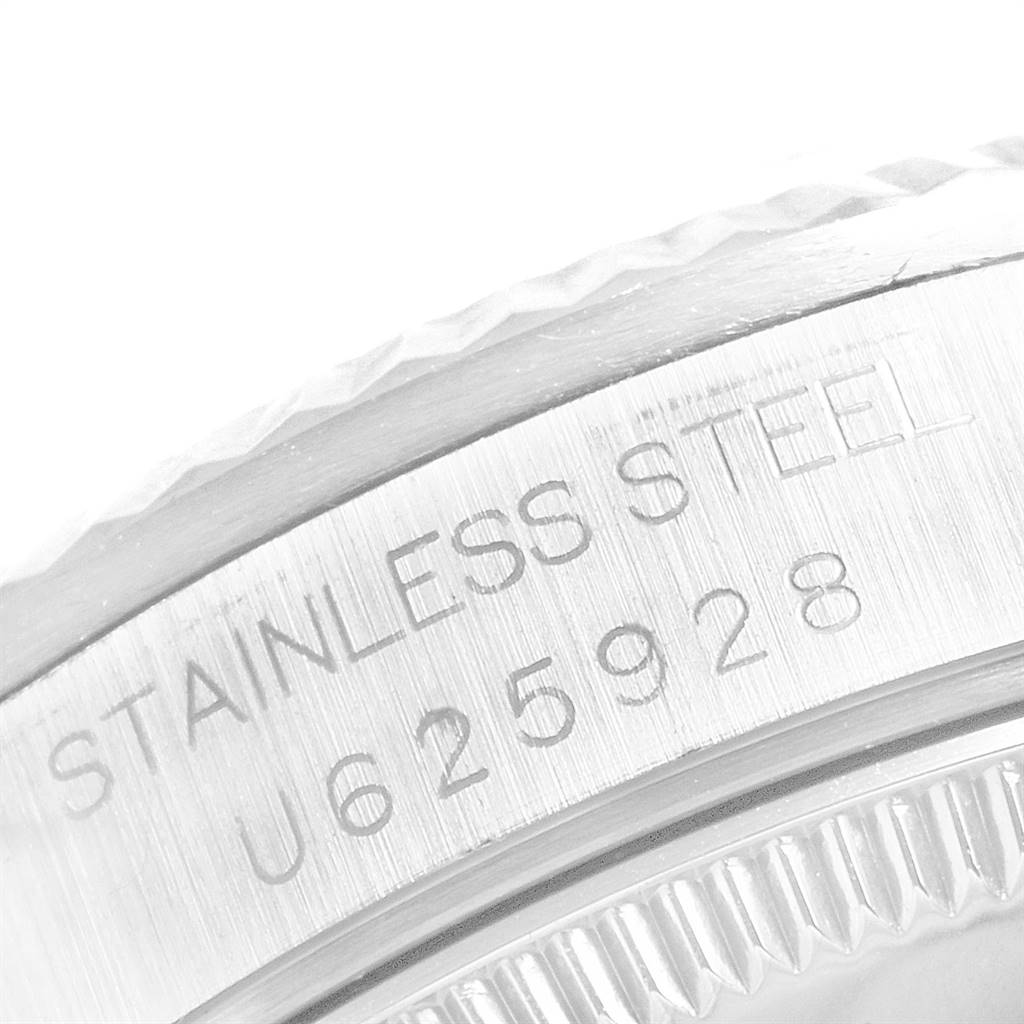 The image shows a close-up of the stainless steel case back of a Rolex Mid-Size 68274 Women's Stainless Steel Blue Dial 68274 Women's Stainless Steel Blue Dial model, highlighting the engraved serial number.