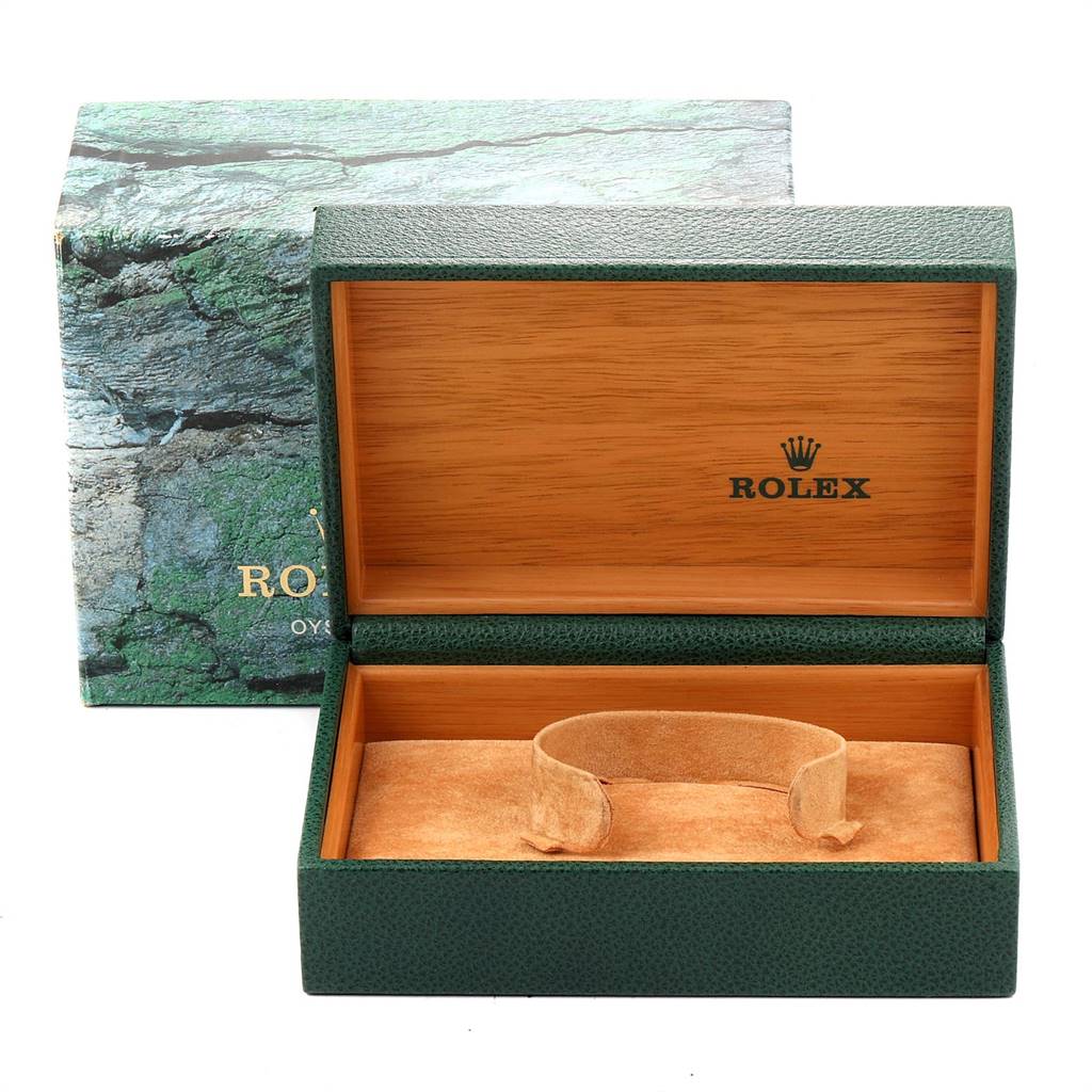 This image shows an open green Rolex watch box with a cushion inside, used for the Mid-Size model.