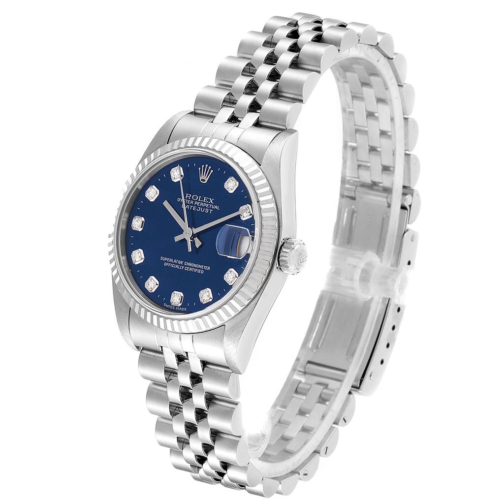 The Mid-Size Rolex watch is shown at a three-quarter angle, displaying the face, bracelet, and crown.
