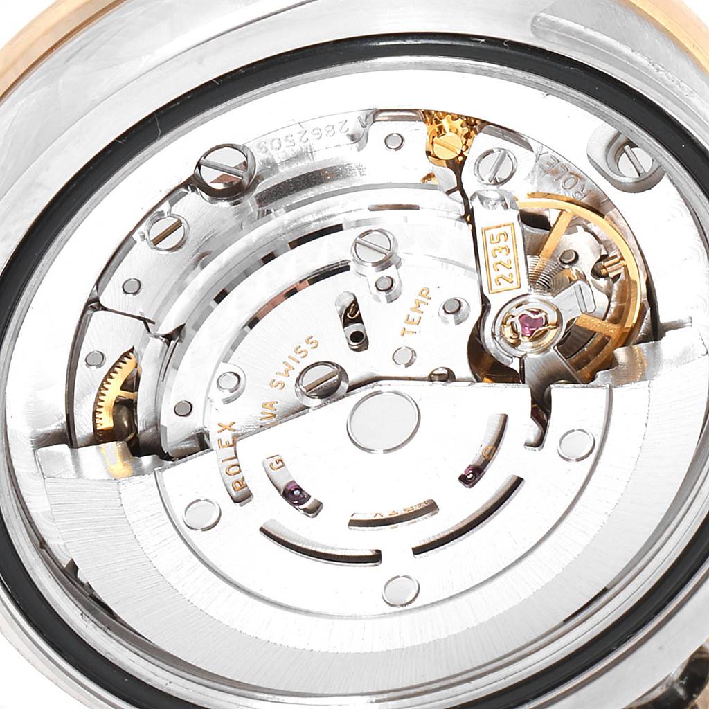 This image shows the movement and internal components of a Rolex Mid-Size 178383 Women's Steel and Gold (two tone) Green Dial 178383 Women's Steel and Gold (two tone) Green Dial watch viewed from the back.