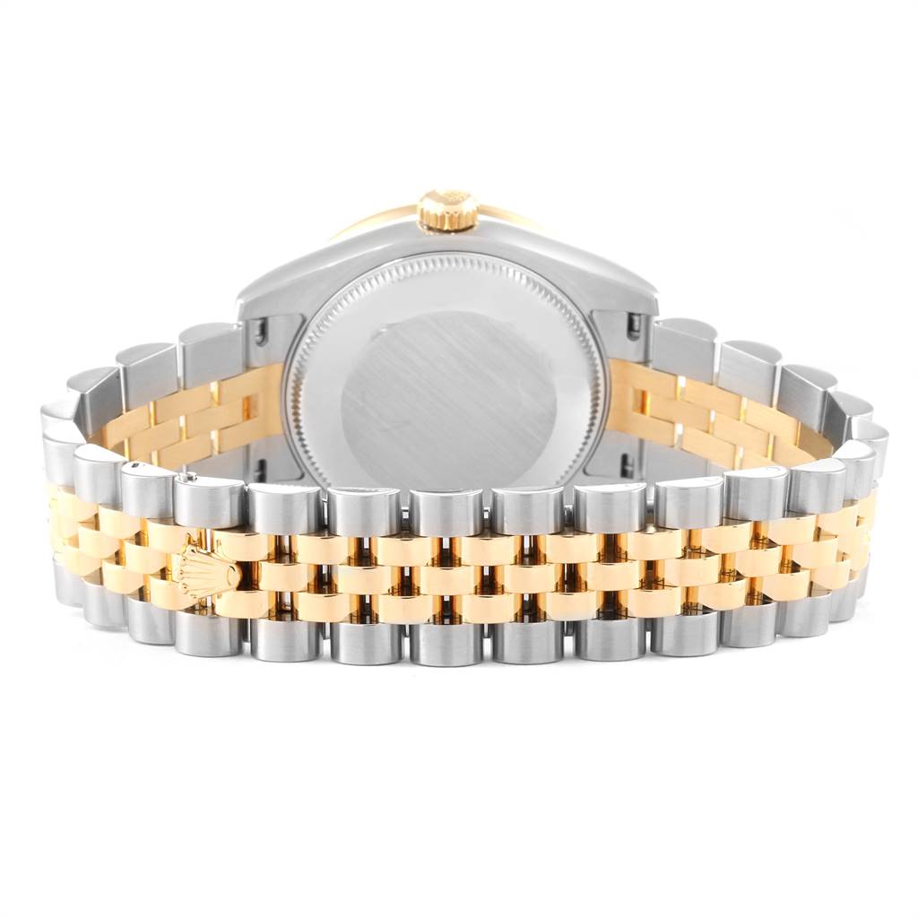 This image shows the back case and bracelet of a mid-size Rolex watch.