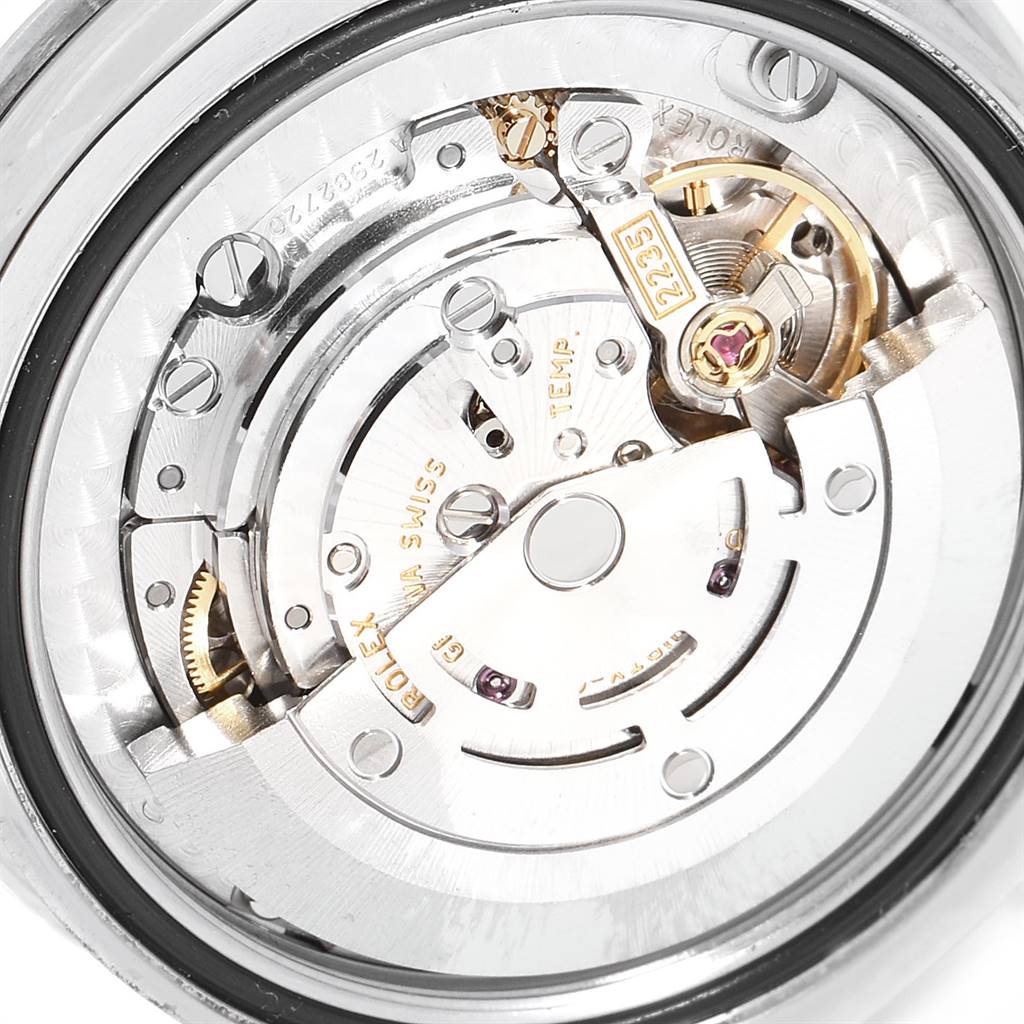 The image shows a close-up view of the movement mechanism of a Rolex Mid-Size 178384 Women's Stainless Steel Mother of Pearl Dial 178384 Women's Stainless Steel Mother of Pearl Dial watch.