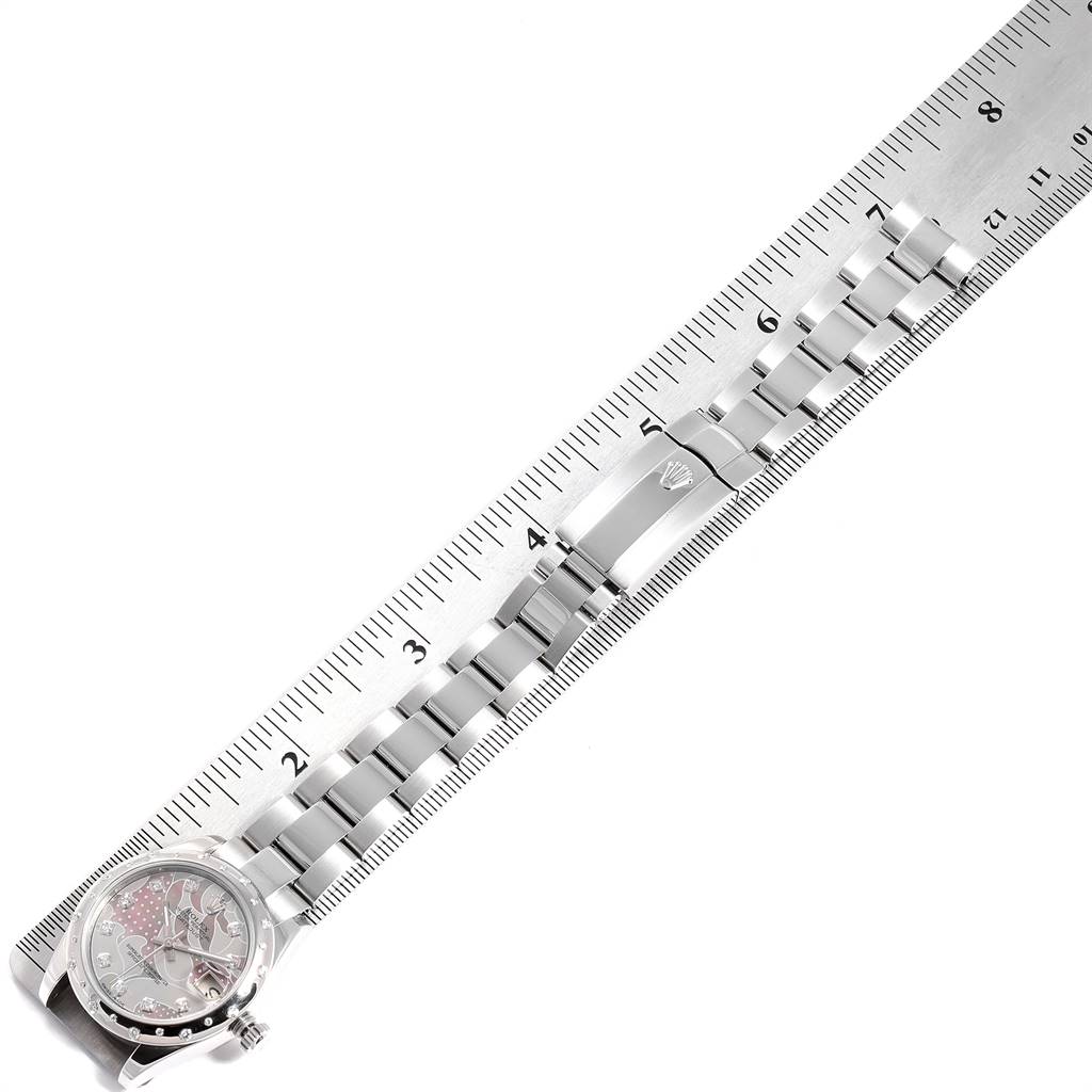 The image shows a Rolex Mid-Size 178344 Women's Stainless Steel Mother of Pearl Dial 178344 Women's Stainless Steel Mother of Pearl Dial watch laid flat next to a measuring ruler, highlighting the dial, bracelet, and clasp.