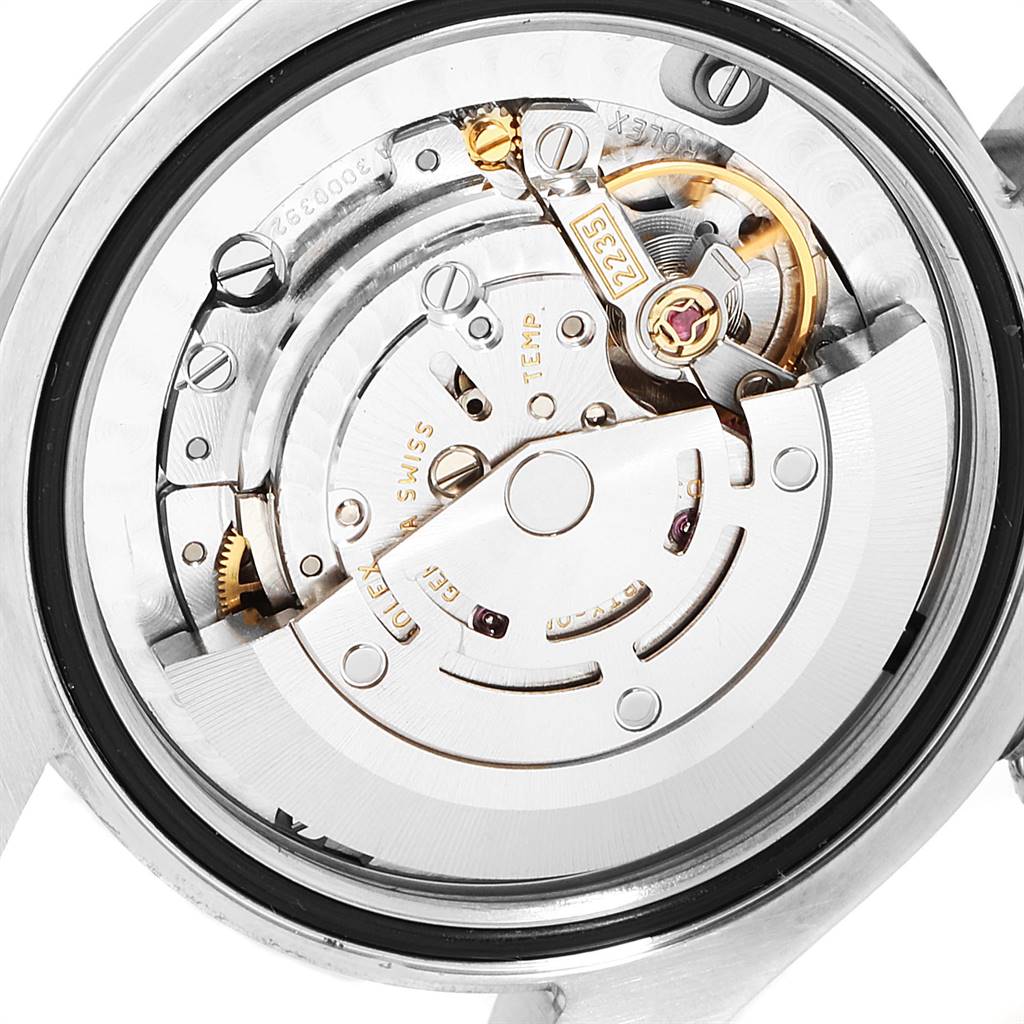 The image shows the inner mechanism of a Mid-Size Rolex watch, viewed from the rear with the case back removed.