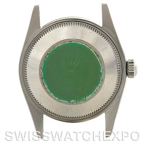 This image shows the back case and crown of a Mid-Size Rolex watch from a rear angle.