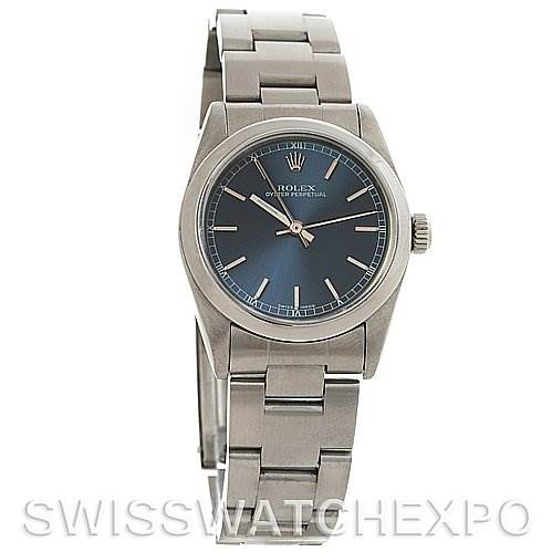 The image shows a front angle of a Rolex Mid-Size 77080 Women's Stainless Steel Blue Dial 77080 Women's Stainless Steel Blue Dial watch, displaying its face, bezel, and metal bracelet.