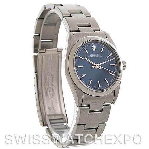 This image shows a Rolex Mid-Size 77080 Women's Stainless Steel Blue Dial 77080 Women's Stainless Steel Blue Dial watch angled to display the face, bezel, bracelet, and partially open clasp with "SWISSWATCHEXPO" watermark at the bottom.