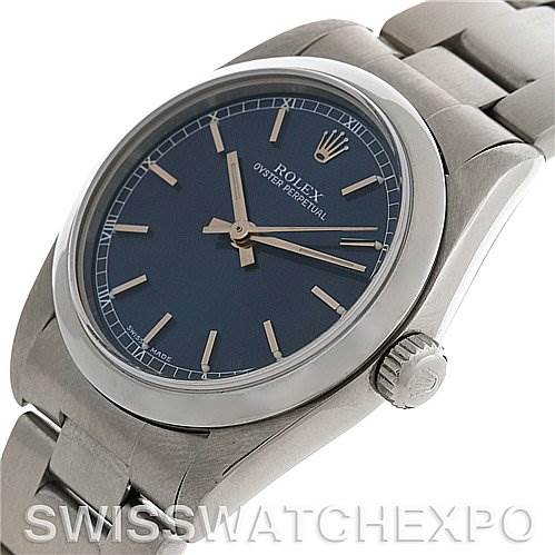 This image shows a mid-size Rolex Oyster Perpetual watch at an angled view, highlighting the dial, crown, and a portion of the bracelet.