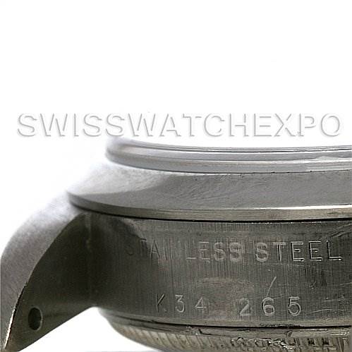 The image shows the side view of the case and lug of a Rolex Mid-Size 77080 Women's Stainless Steel Blue Dial 77080 Women's Stainless Steel Blue Dial watch, highlighting the engravings.