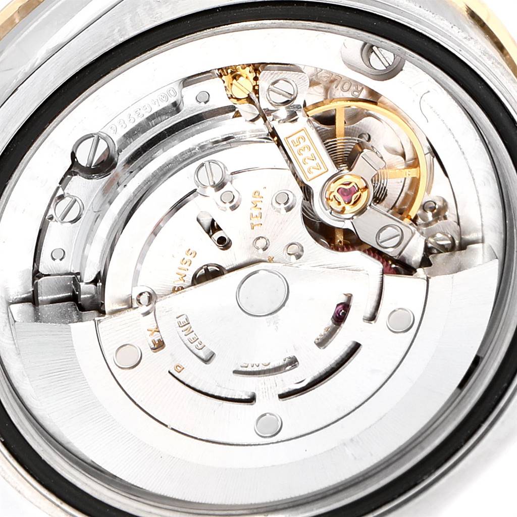 The image shows the internal mechanical movement of a Mid-Size Rolex watch, viewed from the back.