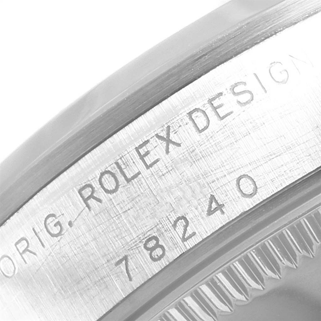 The image shows a close-up of the engraved side of the case of a Rolex Mid-Size 78240 Women's Stainless Steel Blue Dial 78240 Women's Stainless Steel Blue Dial model watch, featuring part of the bezel and case number 78240.