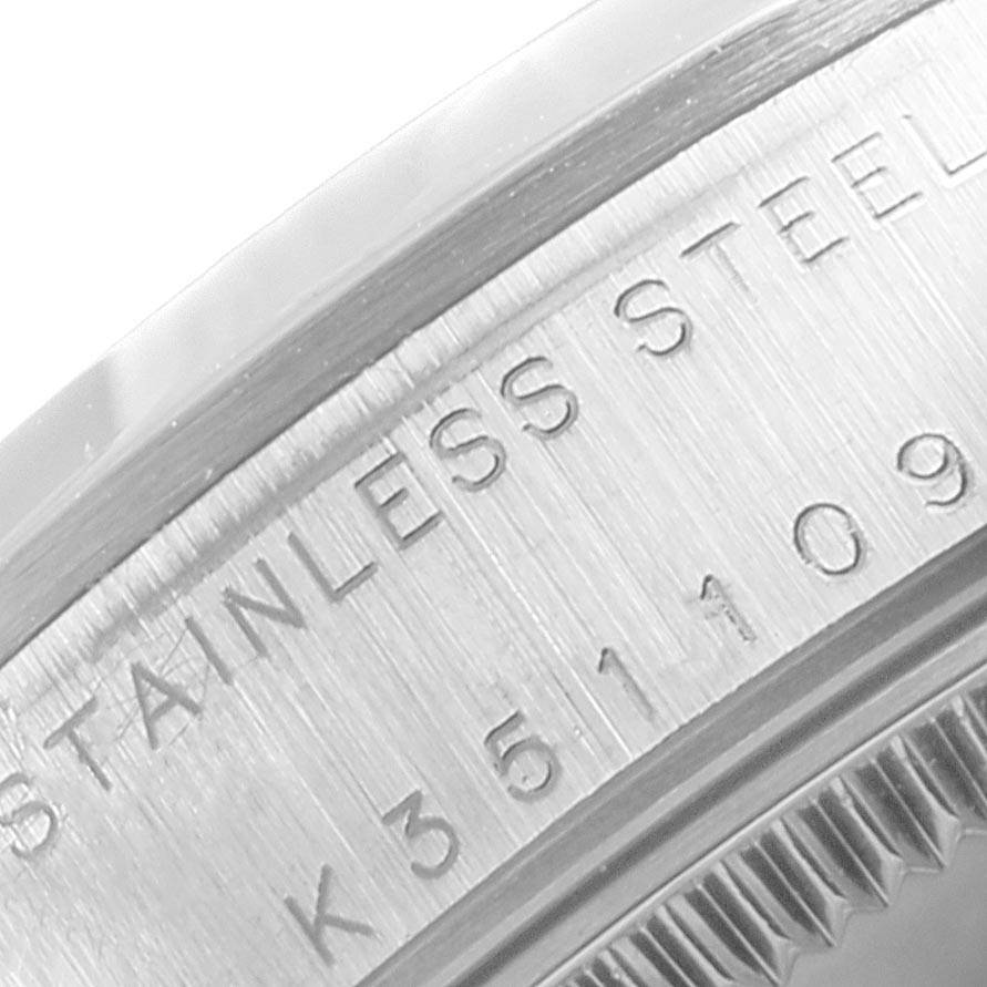 This image shows a close-up of the case back and serial number engraving on a Rolex Mid-Size 78240 Women's Stainless Steel Blue Dial 78240 Women's Stainless Steel Blue Dial watch in stainless steel.