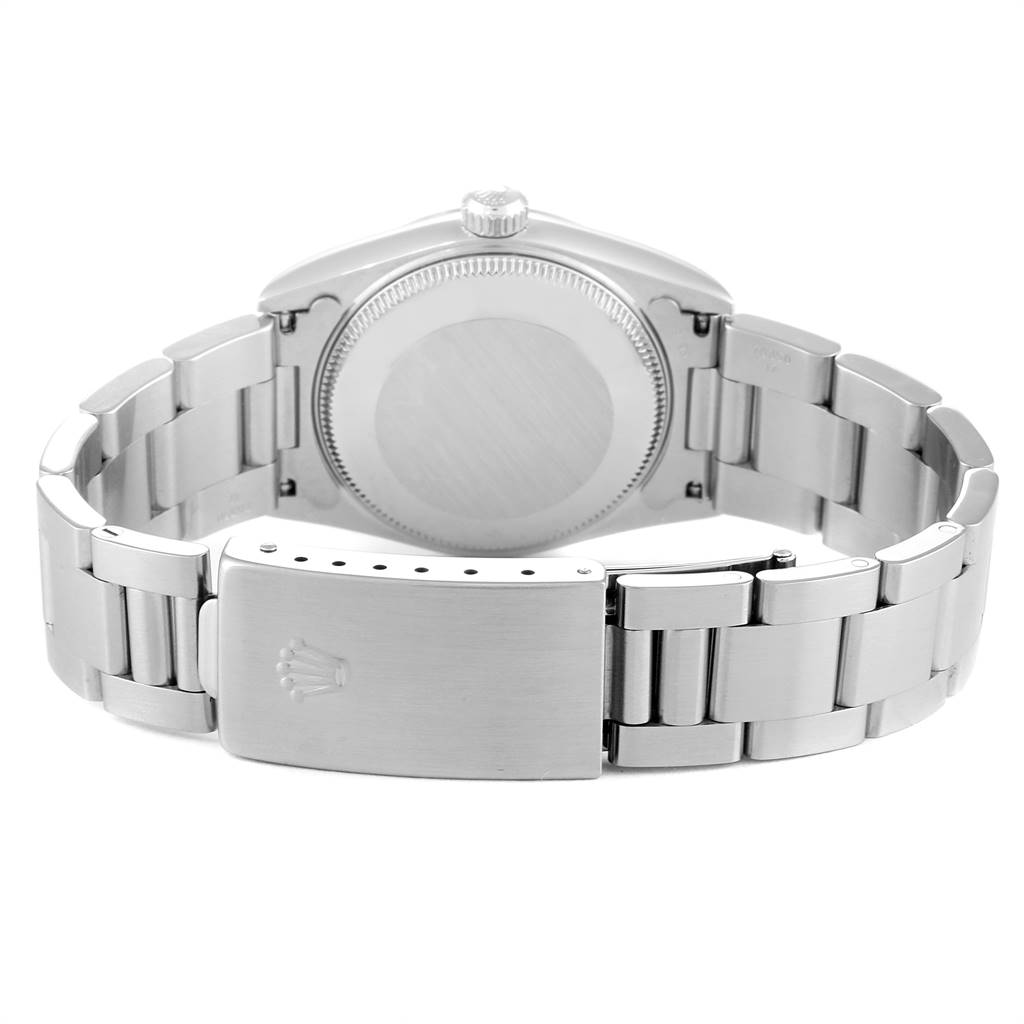 The image shows the back view of a Rolex Mid-Size 78240 Women's Stainless Steel Blue Dial 78240 Women's Stainless Steel Blue Dial watch, featuring its case back, crown, and bracelet with the clasp.