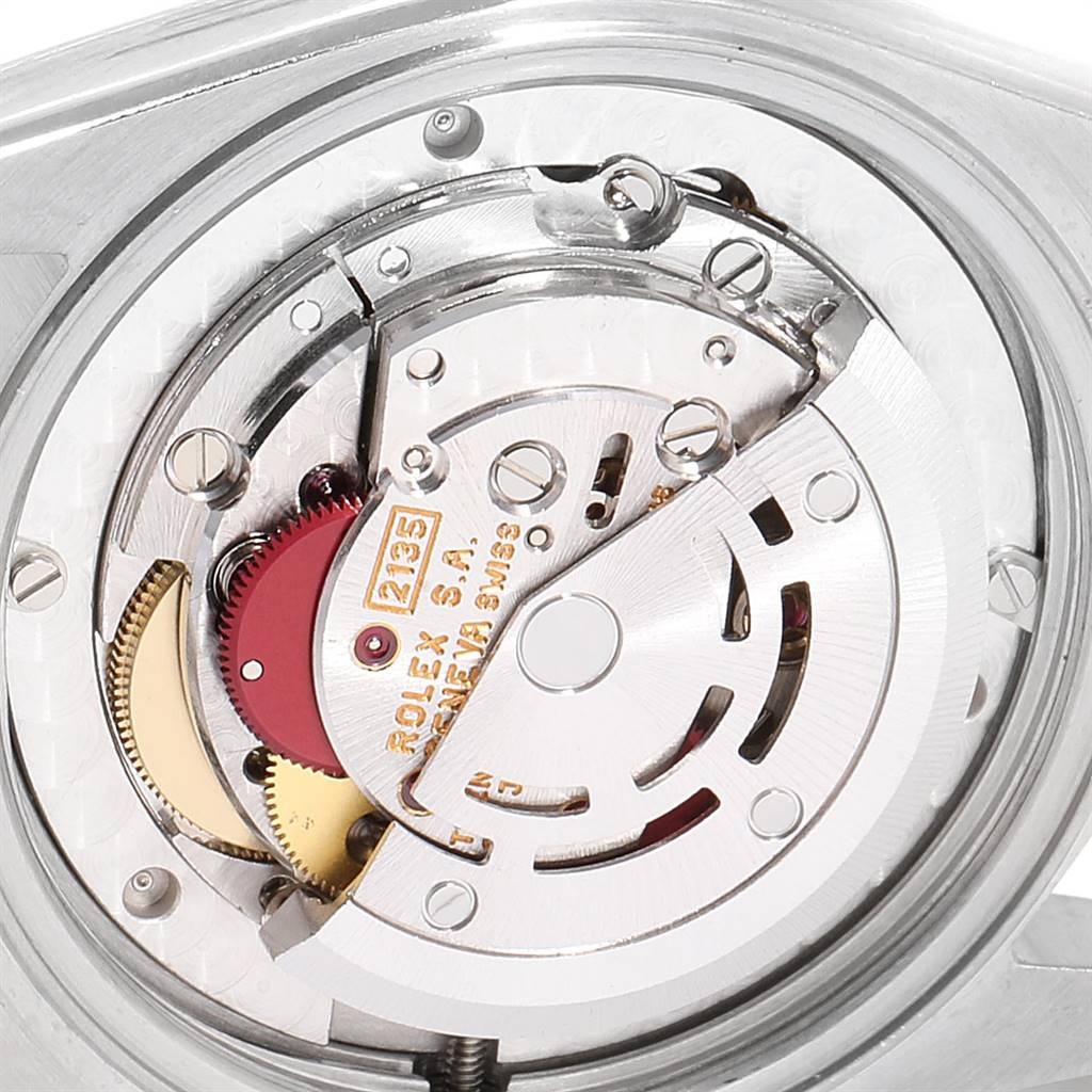 This image shows the inner mechanical components of a Rolex Mid-Size 68273 Women's Steel and Gold (two tone) Black Dial 68273 Women's Steel and Gold (two tone) Black Dial model watch from a close-up angle.