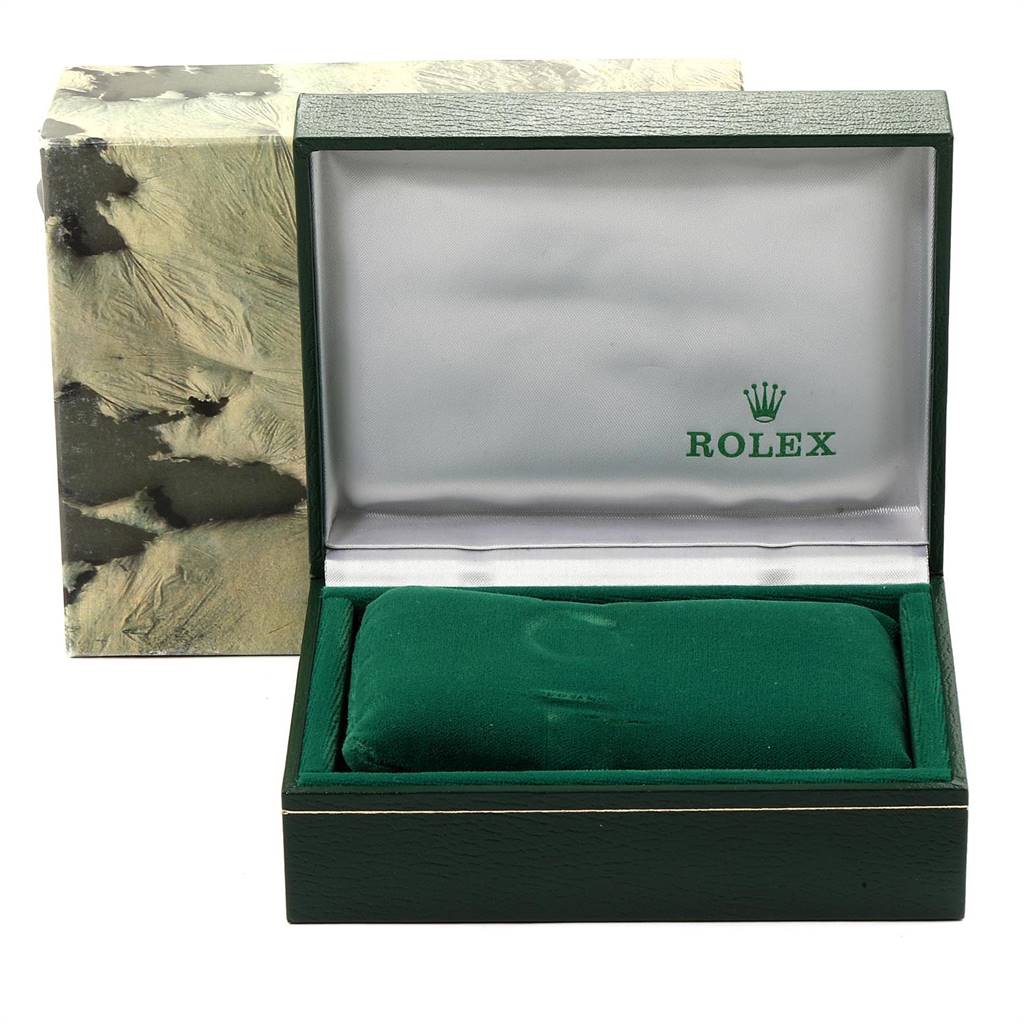 This image shows an open green Rolex watch box for the Mid-Size model, with the cushion and logo visible.