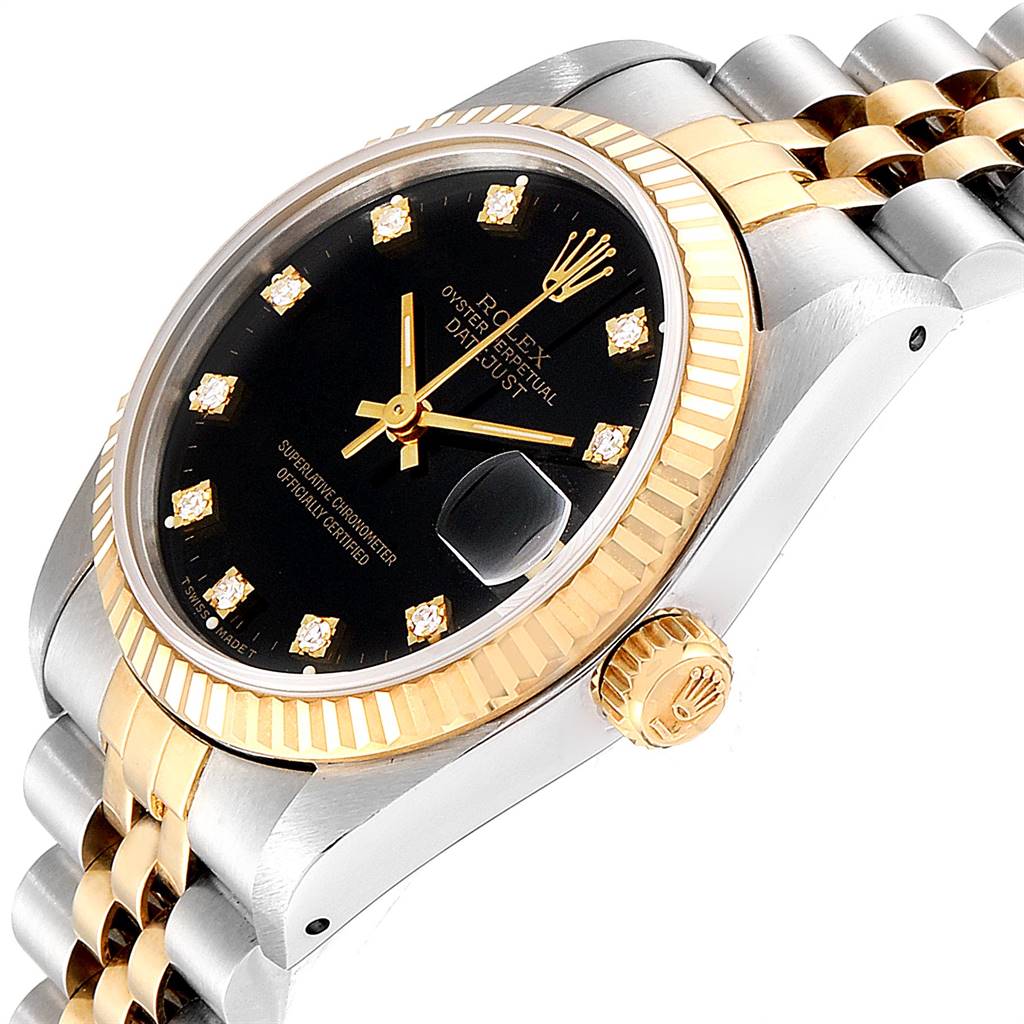 The image shows a Rolex Mid-Size 68273 Women's Steel and Gold (two tone) Black Dial 68273 Women's Steel and Gold (two tone) Black Dial Datejust watch from an angled side view, displaying its black dial, gold bezel, crown, and two-tone bracelet.