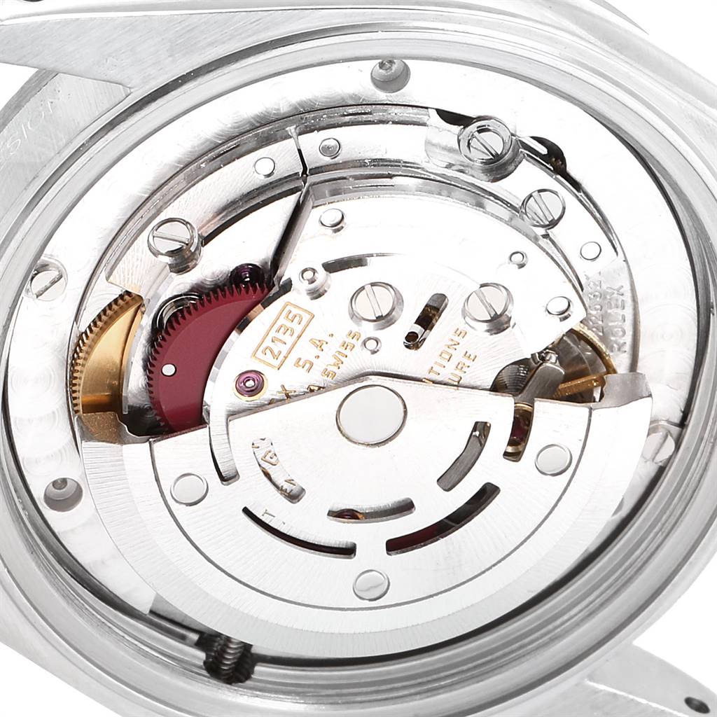 The image shows the internal movement mechanism of the Mid-Size Rolex watch from the back.