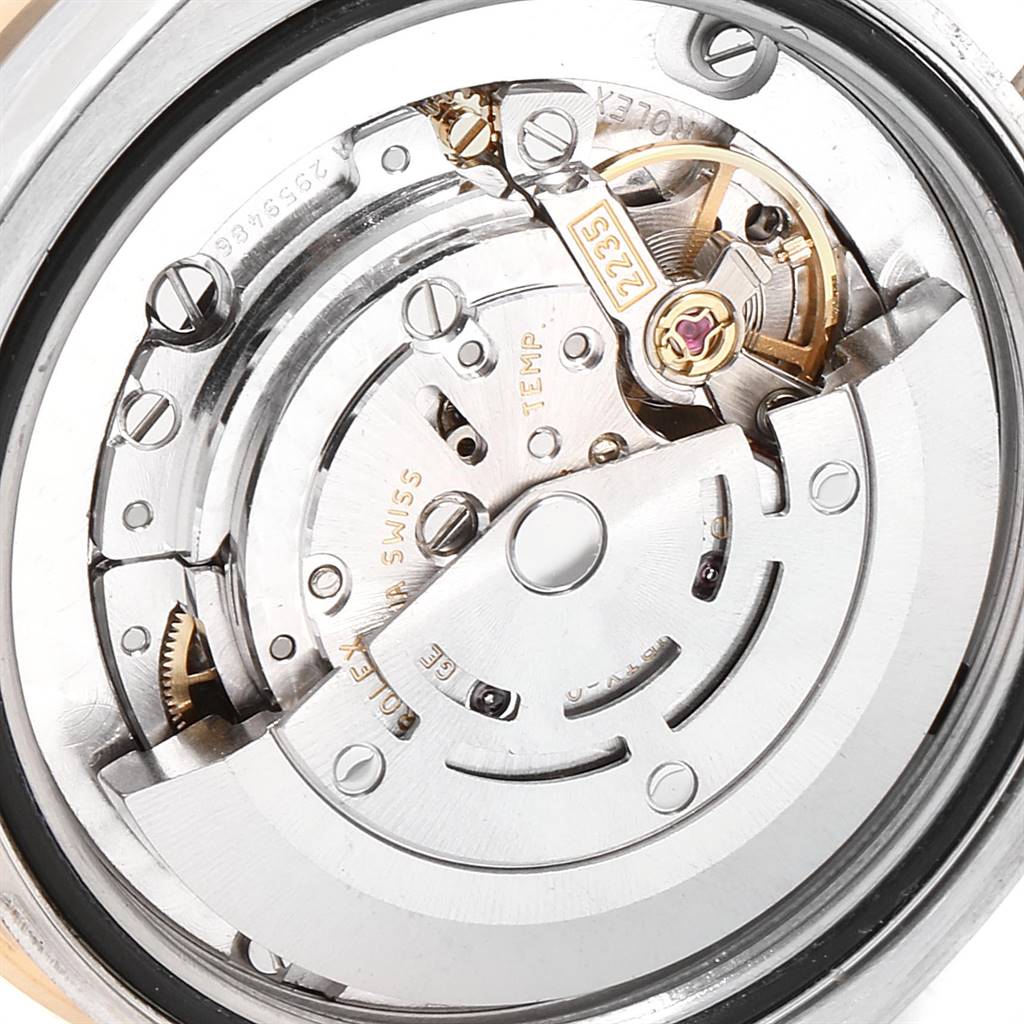 This image shows a close-up, angled view of the movement mechanism of a Mid-Size Rolex watch.