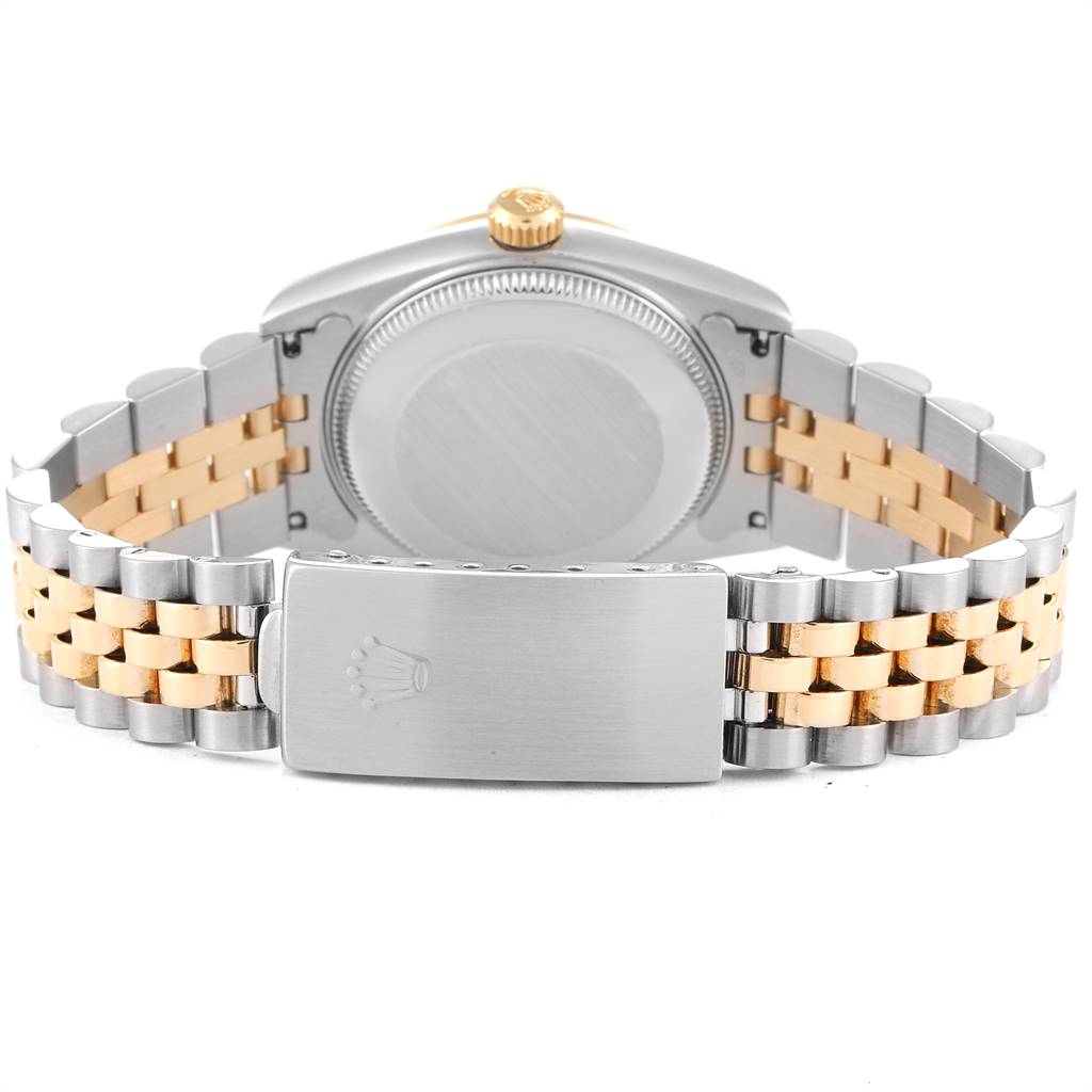 The image shows the back view of a Rolex Mid-Size 68273 Women's Steel and Gold (two tone) Champagne Dial 68273 Women's Steel and Gold (two tone) Champagne Dial model watch focusing on the case back and bracelet clasp.