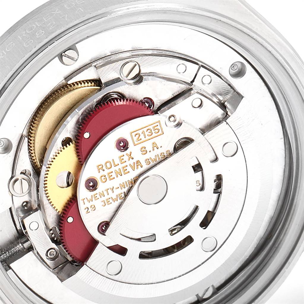 The image shows an internal view of the Rolex Mid-Size 68274 Women's Stainless Steel Silver Dial 68274 Women's Stainless Steel Silver Dial model's movement and mechanical parts from a top-down angle.