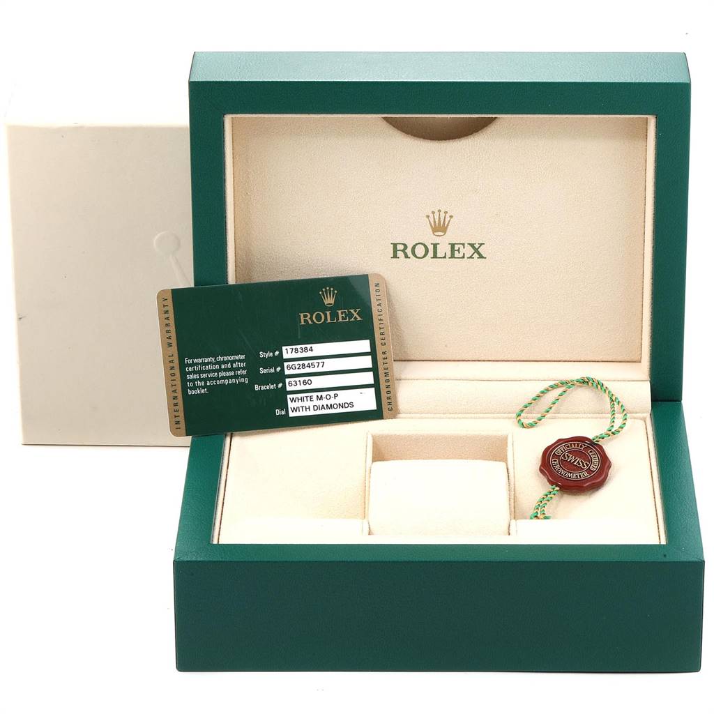 The image shows a Rolex Mid-Size 178384 Women's Stainless Steel Mother of Pearl Dial 178384 Women's Stainless Steel Mother of Pearl Dial model watch box with its warranty card, tag, and certificate holder.