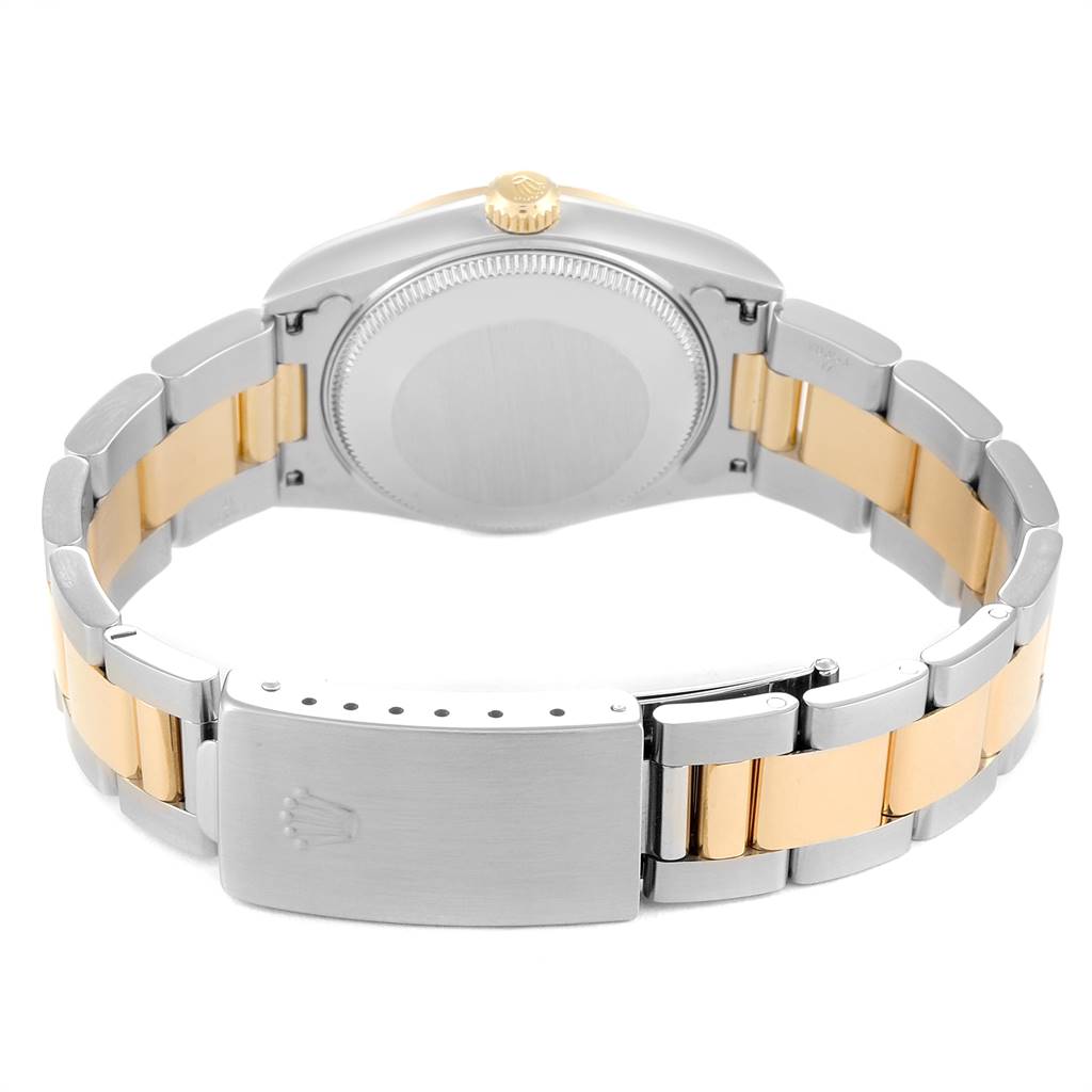 This image shows the back and clasp of the bracelet of a Rolex Mid-Size 78273 Women's Steel and Gold (two tone) Black Dial 78273 Women's Steel and Gold (two tone) Black Dial watch.
