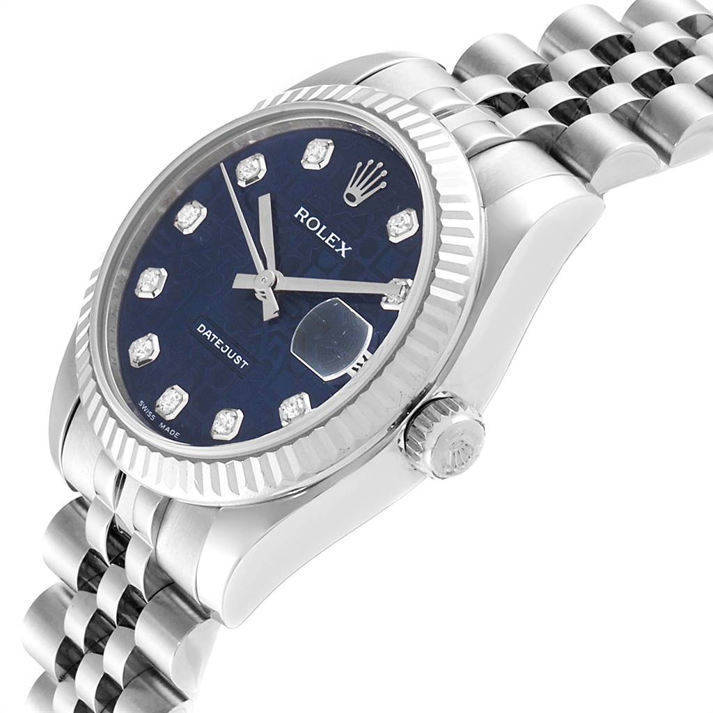 This image shows a side angle of the Rolex Mid-Size 178274 Women's Stainless Steel Blue Dial 178274 Women's Stainless Steel Blue Dial Datejust watch, displaying the crown, bezel, and part of the bracelet.