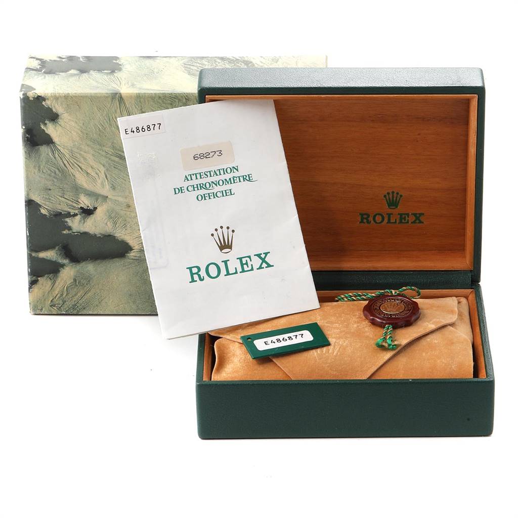 The image shows the box, certificate, and pouch for a Mid-Size Rolex watch, with the box open and the documentation visible.