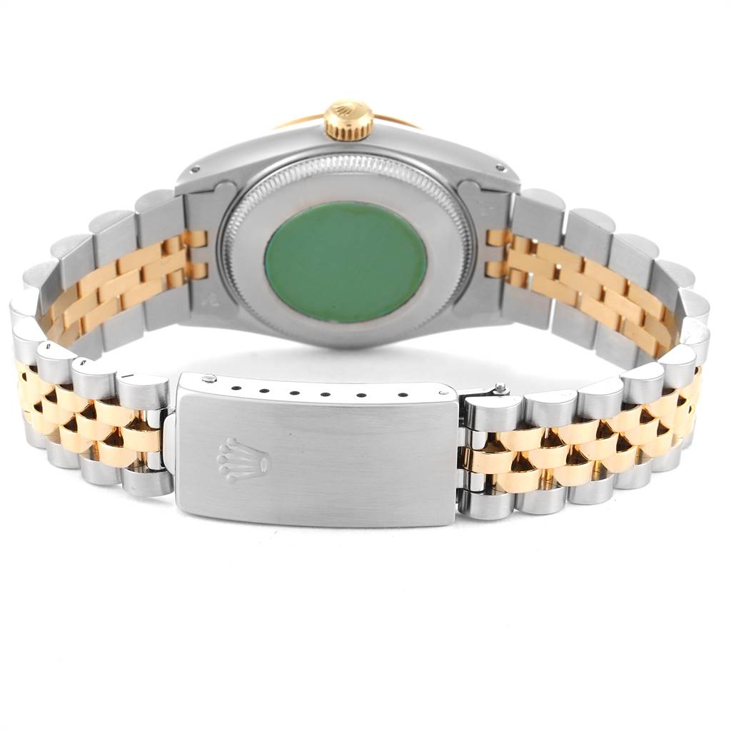 The image shows the back view of a Rolex Mid-Size 68273 Women's Steel and Gold (two tone) Champagne Dial 68273 Women's Steel and Gold (two tone) Champagne Dial watch, highlighting the green case back, jubilee bracelet, and clasp with the Rolex logo.