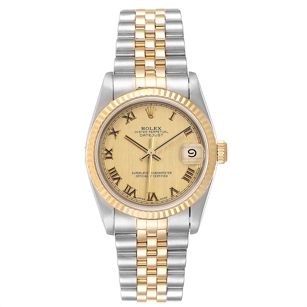 The image shows a front view of a Rolex Mid-Size 68273 Women's Steel and Gold (two tone) Champagne Dial 68273 Women's Steel and Gold (two tone) Champagne Dial Datejust watch, highlighting its gold and silver bracelet, fluted bezel, and date window.