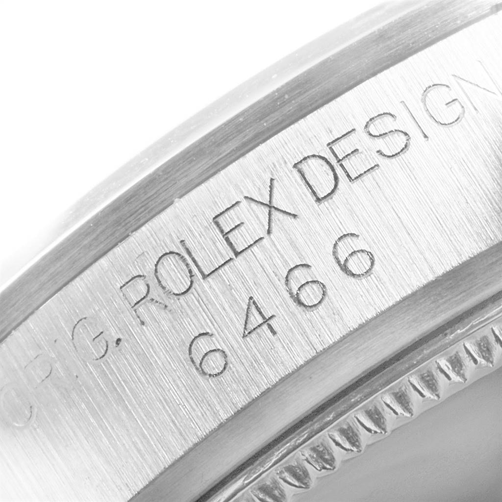 This close-up image shows the engraved side of a Mid-Size Rolex watch case with the model number.