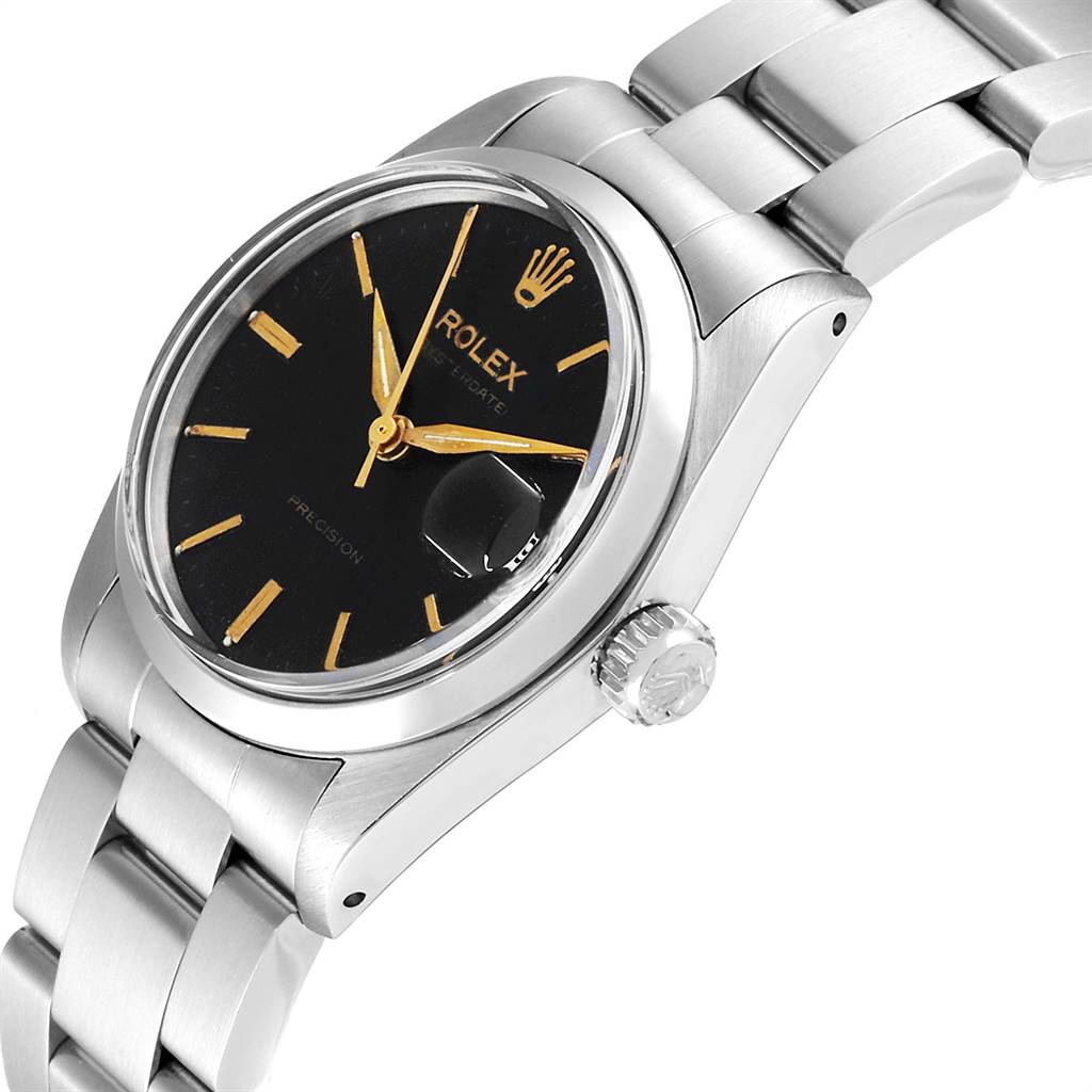 This image shows a side angle of the Rolex Mid-Size 6466 Women's Stainless Steel Black Dial 6466 Women's Stainless Steel Black Dial watch, highlighting its crown, bracelet, and black dial with gold markers.